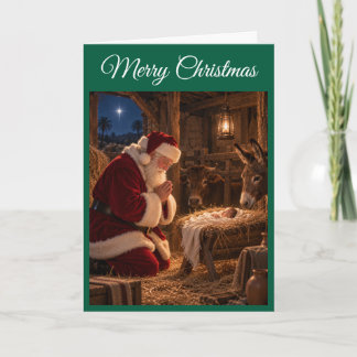 Kerstkaart van Kerstman biddend bij de kribbe Kaart