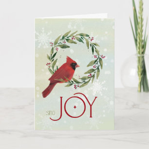 Kerstkardinaal in festieve krans met Sing Joy Kaart