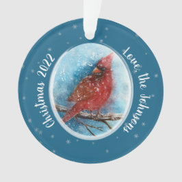 Kerstkardinale sneeuwvlokken op rood of blauw ornament