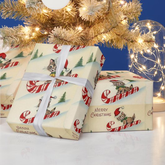 Kerstkatje rijdt op een zuurstok cadeaupapier (Feestdagen)