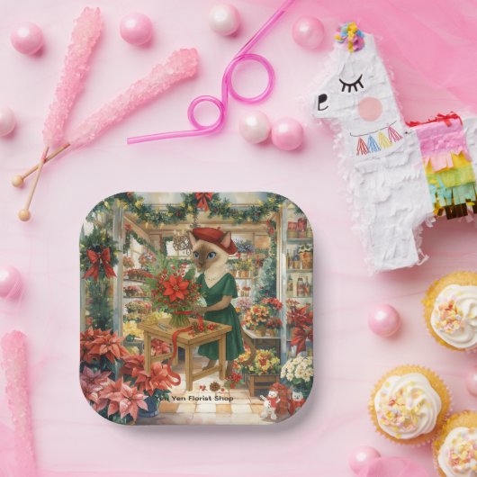 Kerstkattenbloemist is bloemen aan het regelen papieren bordje (Feest)