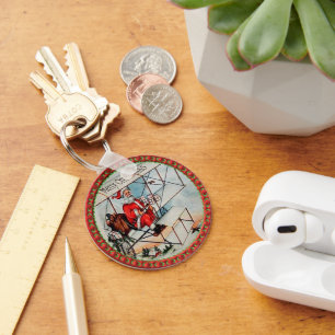 Kerstkerstman die een oud vliegtuig vliegt sleutelhanger