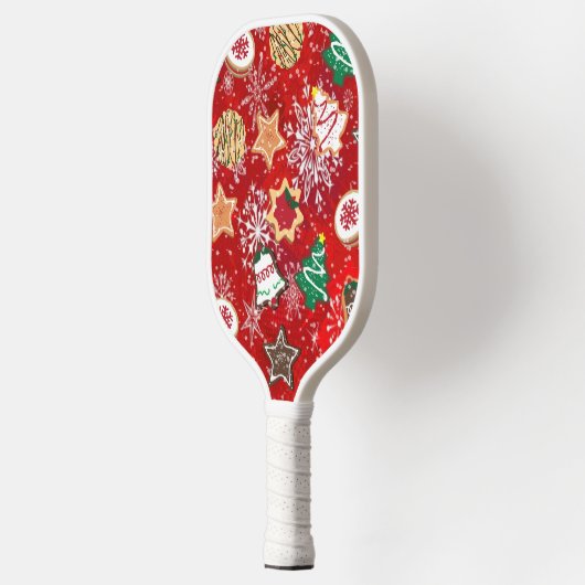 Kerstkoekjes en sneeuwvlokken op rood pickleball paddle (Links)