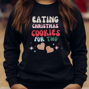Kerstkoekjes eten voor twee trui