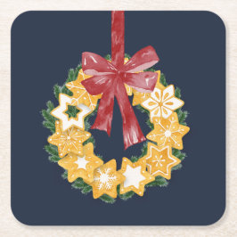 Kerstkoekjes met blauwe grijze achtergrond vierkante kartonnen onderzetter