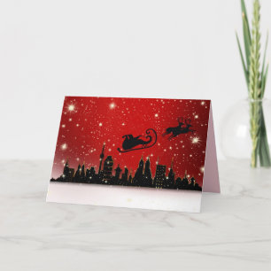 Kerstman boven de stad wenskaart kaart