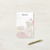 Kerstman Chihuahua Dogs plaatst het briefje Post-it® Notes (Op bureau)