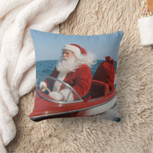 Kerstman die cadeaus bezorgt per speedboot kussen