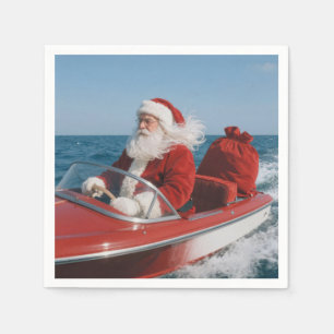 Kerstman die cadeaus bezorgt per speedboot servet