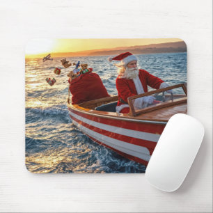 Kerstman die een speedboot bestuurt muismat