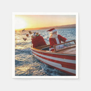 Kerstman die een speedboot bestuurt servet