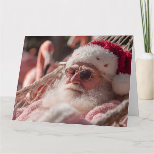 Kerstman die ontspant in een hangmat en een zonneb kaart