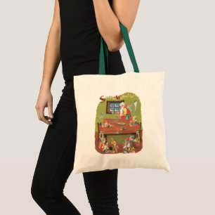 Kerstman met elfen in de werkplaats tote bag