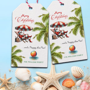 Kerstman onder een strandparasol Kerstmis Cadeaulabel