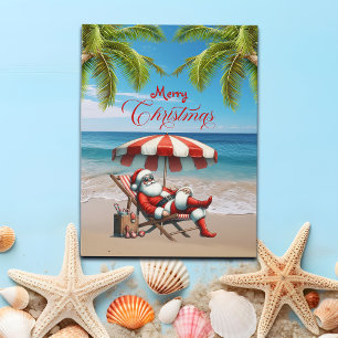 Kerstman onder een strandparasol Kerstmis Feestdagenkaart