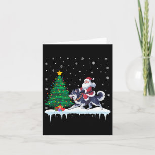 Kerstman rijdt op Alaskan Klee Kai-hond jongens me Kaart