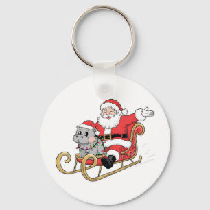 Kerstman rijdt slee met een Moo Deng baby nijlpaar Sleutelhanger