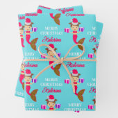 Kerstmeisje kerstman kerstman kerstman kerstman ke inpakpapier vel (In situ)