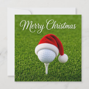 Kerstmis golfen met kerstman hoed op groen gras kaart