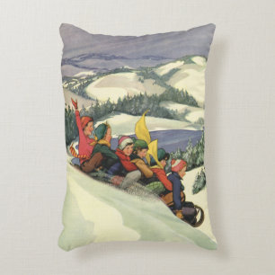 Kerstmis in vintage stijl, kinderen sleeën op een accent kussen