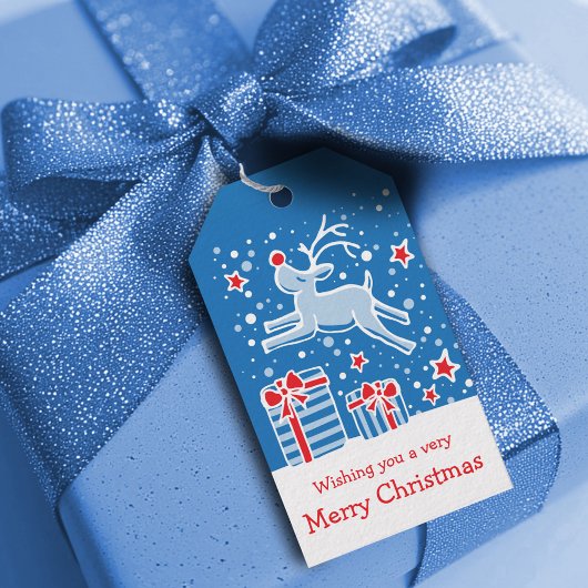 Kerstmis rendieren springen over geschenken blauw  cadeaulabel