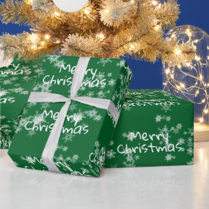 Kerstmis tekst in sneeuwvlokken cadeaupapier
