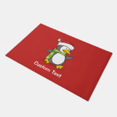 Kerstpinguïn loopt op sneeuw deurmat (Schuin)