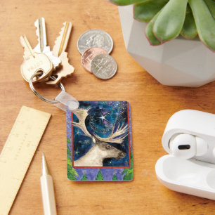 Kerstrendiertje bij nacht met een Shining Star Sleutelhanger