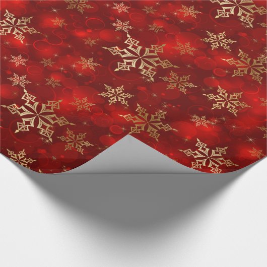 kerstschilfers met rode en gouden sneeuwvlokken cadeaupapier (Hoek)