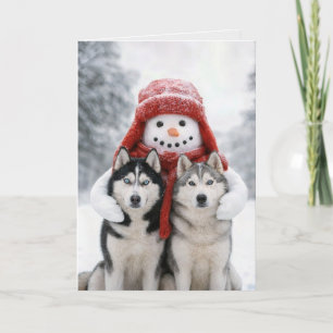 Kerstsneeuwman knuffelt Siberische Husky-honden Kaart