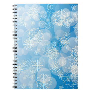Kerstsneeuwvlokken op een blauwe achtergrond notitieboek