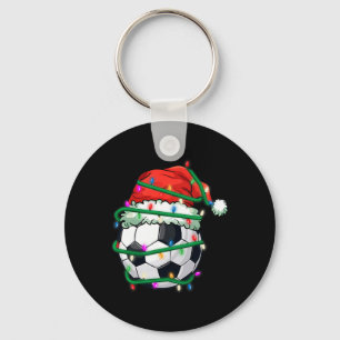 Kerstsvoetbal in kerstmuts tijdens Kerstmis licht Sleutelhanger