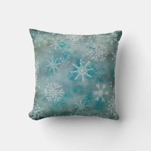 Kerstwinterwitte sneeuwvlokken op blauw kussen