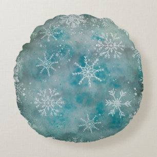 Kerstwinterwitte sneeuwvlokken op blauw rond kussen