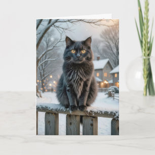 Kerstzwarte kat op een besneeuwd hek kaart