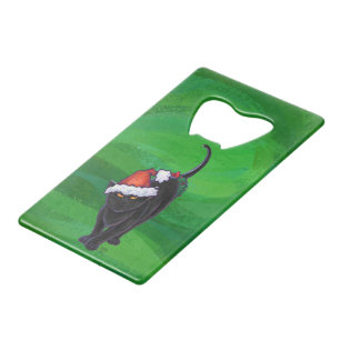 Kerstzwarte kat op groen kredietkaart flessenopener
