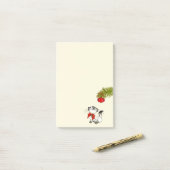 Keukenkat in een rode kerstbak post-it® notes (Op bureau)