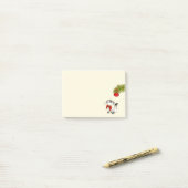 Keukenkat in een rode kerstbak post-it® notes (Op bureau)