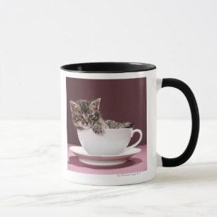 Keuten in beker en saucer mok