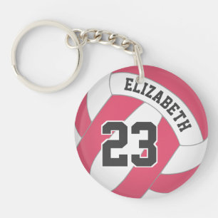 kies voor het volleybal van roze witte meisjes in sleutelhanger