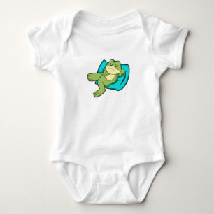 Kikker bij het slapen met piloot romper