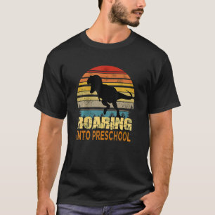 Kinder zwerving naar preschooldinosaurus terug naa t-shirt