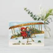 kinderen in een vliegtuig dat op zoek is naar de feestdagenkaart (Staand voorkant)