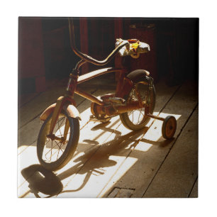 Kinderfiets in de voormalige rist-fabriek tegeltje