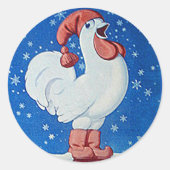 Kip in rood pet zingt in label met kerstsneeuw (Voorkant)