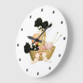 Kittens in mandje grote klok (Hoek)