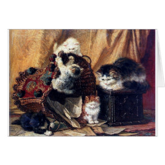 Kittens spelen met antiek schilderij in de mand