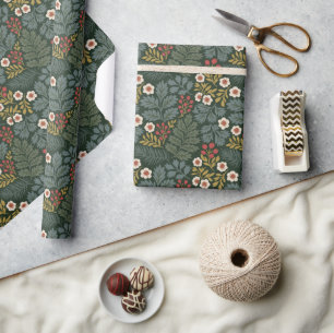 Klassiek kerst-bloemendecor in donkergroene inpakp cadeaupapier