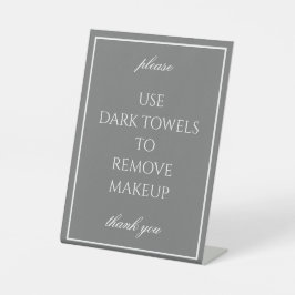 Klassieke eenvoudige donkergrijze handdoekteller reclamebord met voetstuk