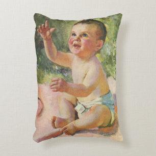 Klassieke kinderen, schattig babymeisje op een roz accent kussen